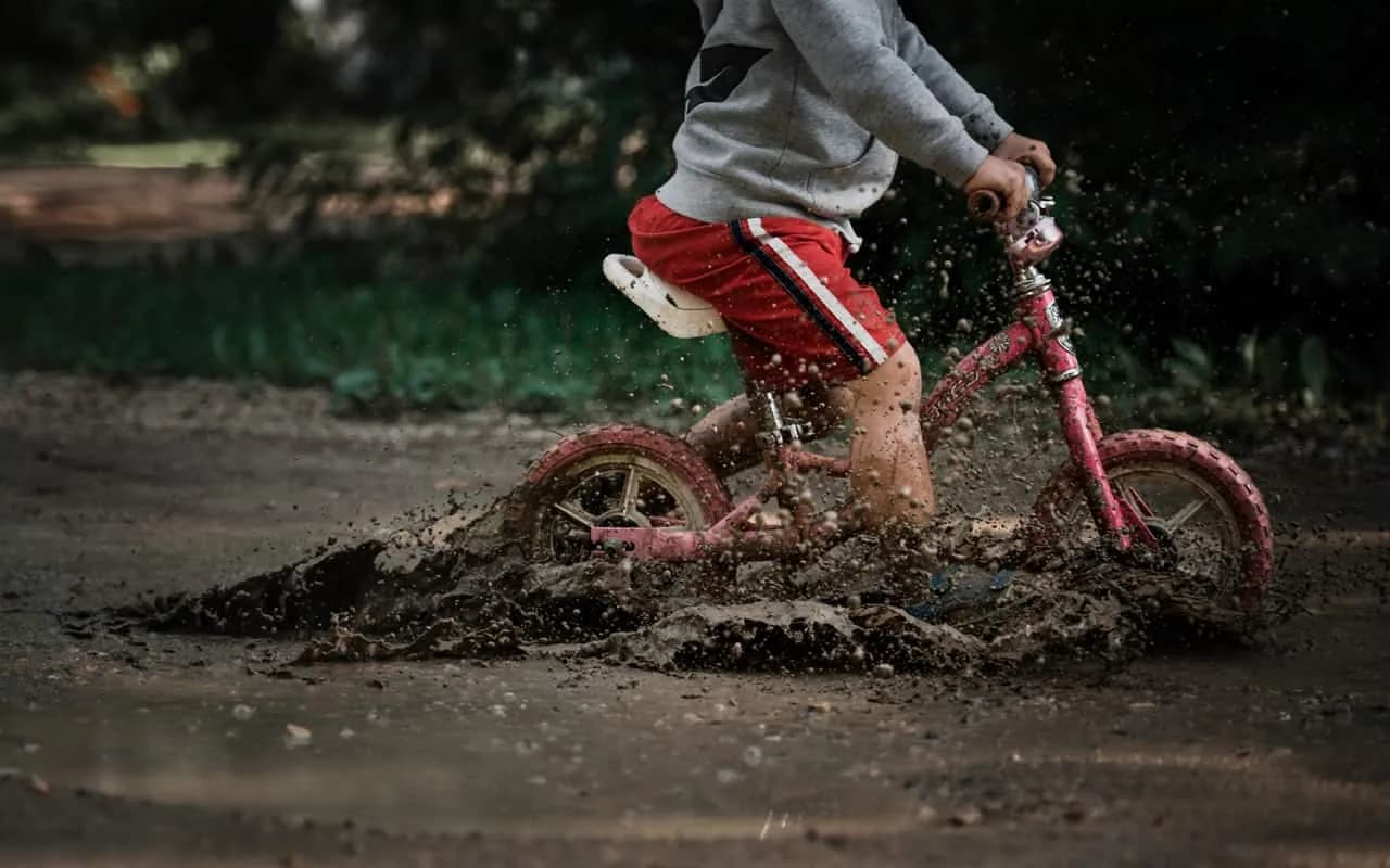 Bike through a mud puddle