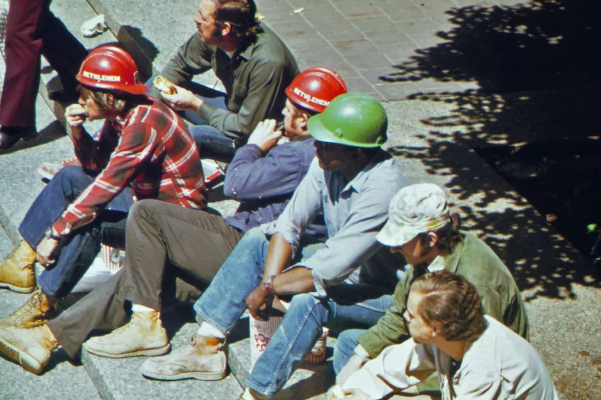 construction crew sitting on curb