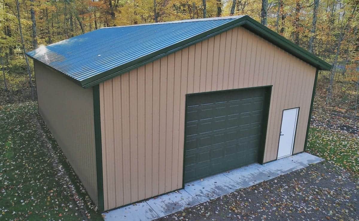 Sherman pole building with eave-side garage doors
