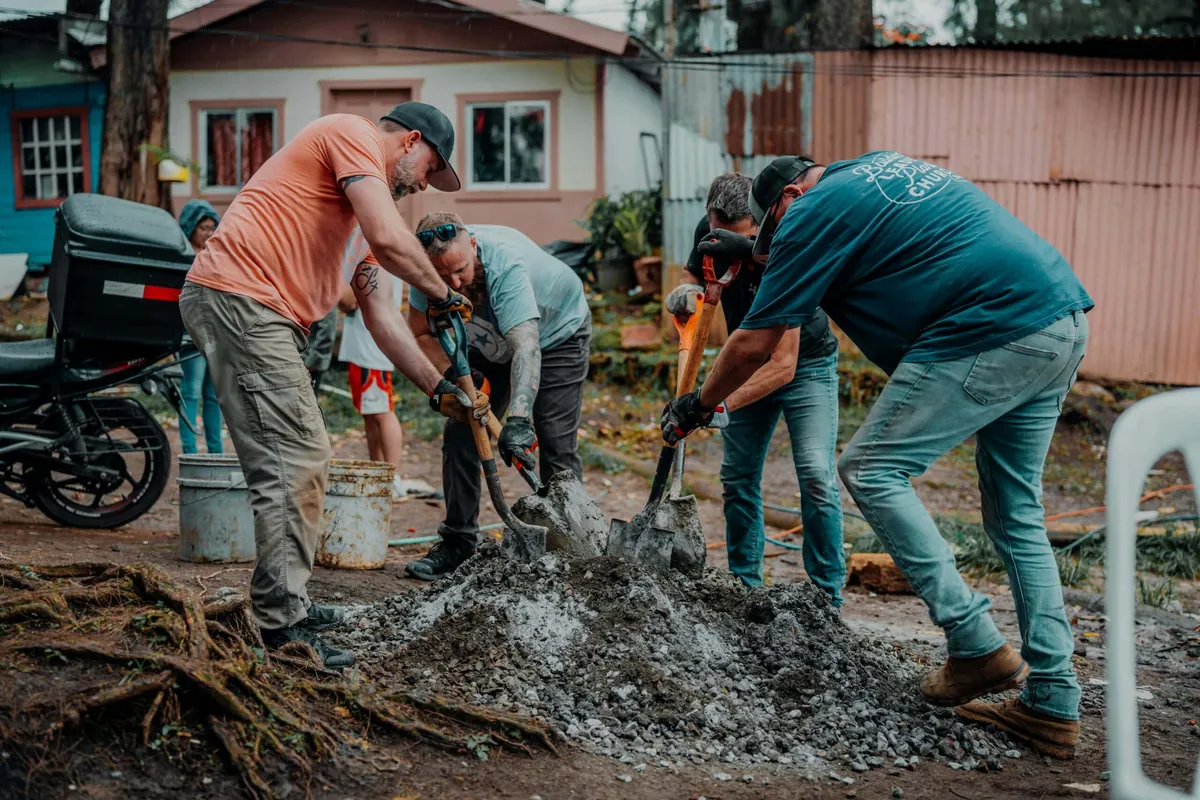 construction crew shoveling dirt