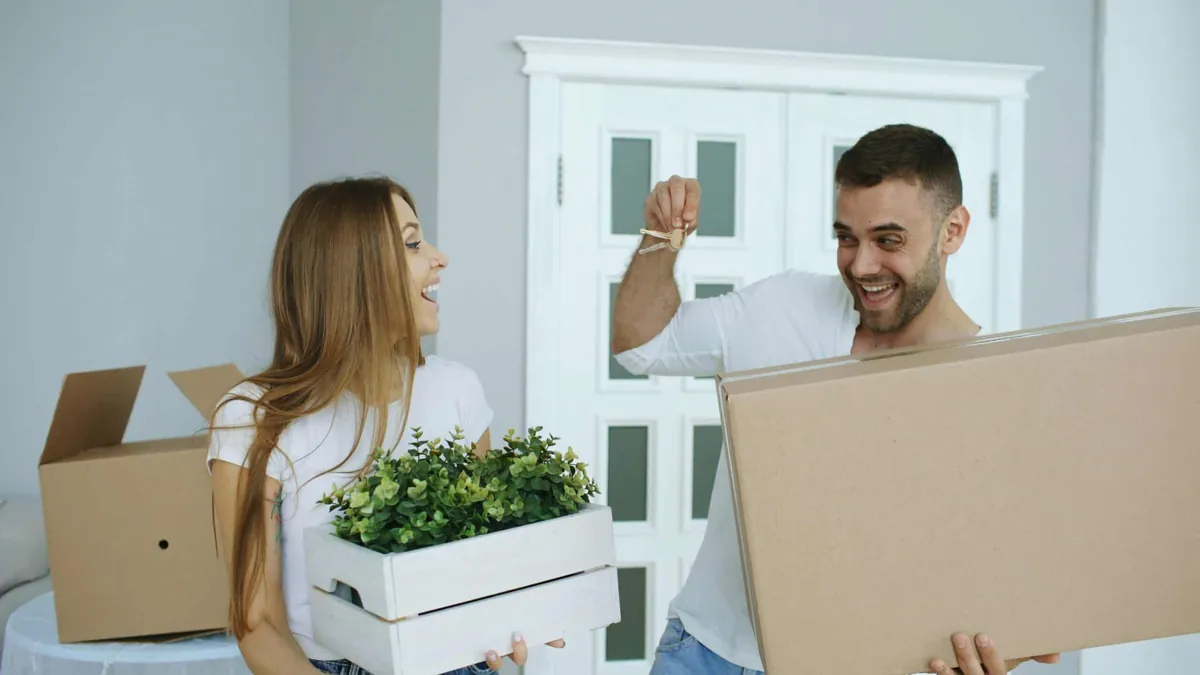 happy homeowners moving in